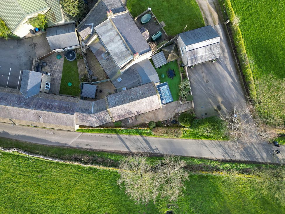 An aerial view of buildings and a garden at Johns Cottage in Hampsthwaite