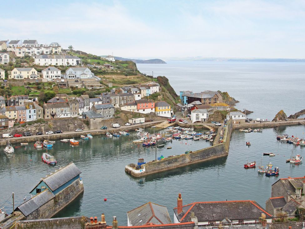 A view of a harbor with boats and houses at The Millhouse in St Blazey