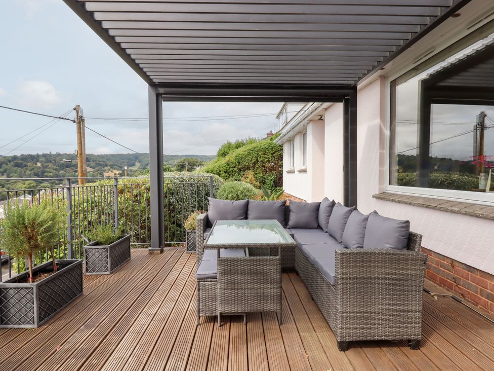 An outdoor seating area with a table at 15 Summerland Avenue, Dawlish