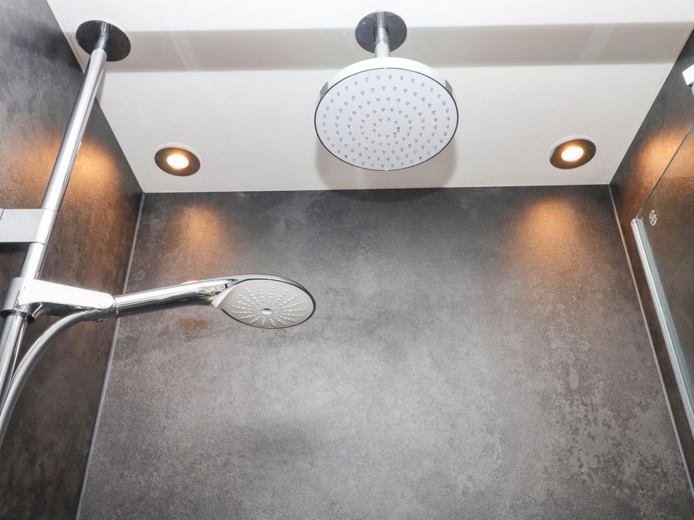 A shower area with showerhead and lighting at 15 Summerland Avenue Dawlish
