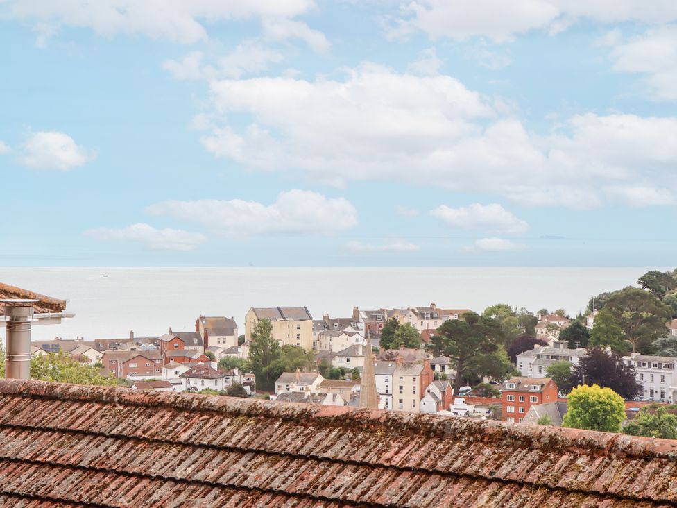 A view of houses and the sea at 15 Summerland Avenue Dawlish