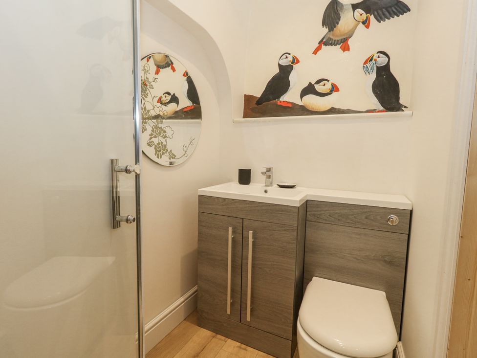A bathroom with a sink and toilet at Sea Pink Studio in Swanage