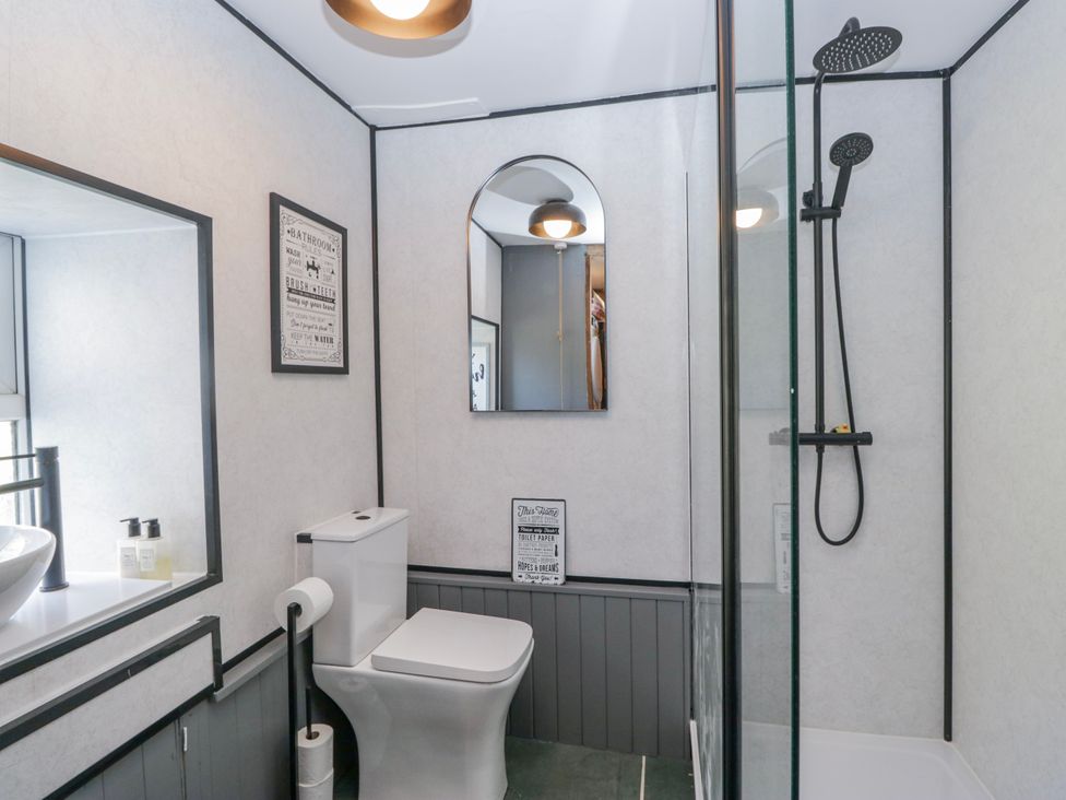 A bathroom with shower and toilet at High Ickenthwaite Farmhouse in Ulverston