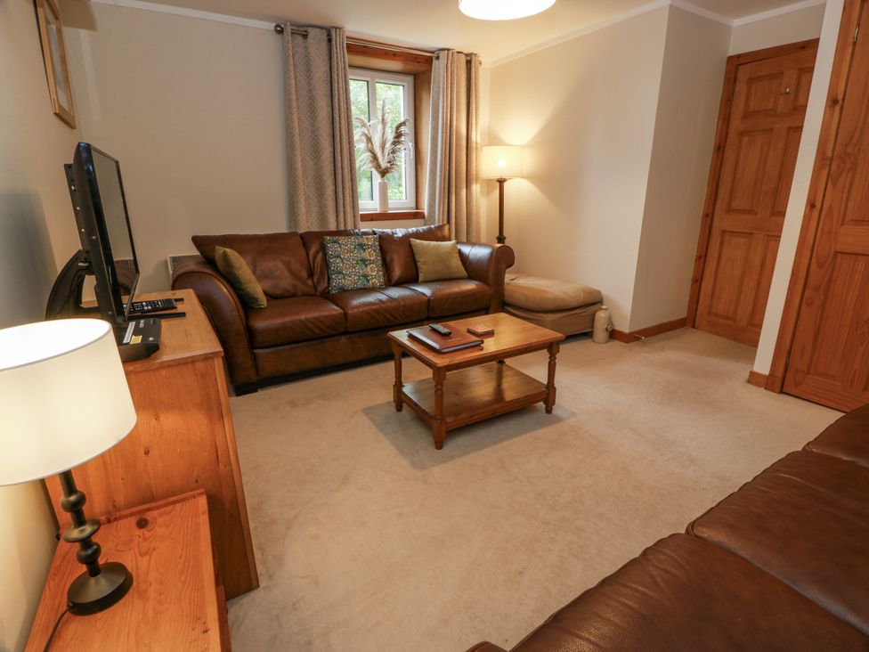A living room with a sofa and coffee table at The Steading in Castle Douglas