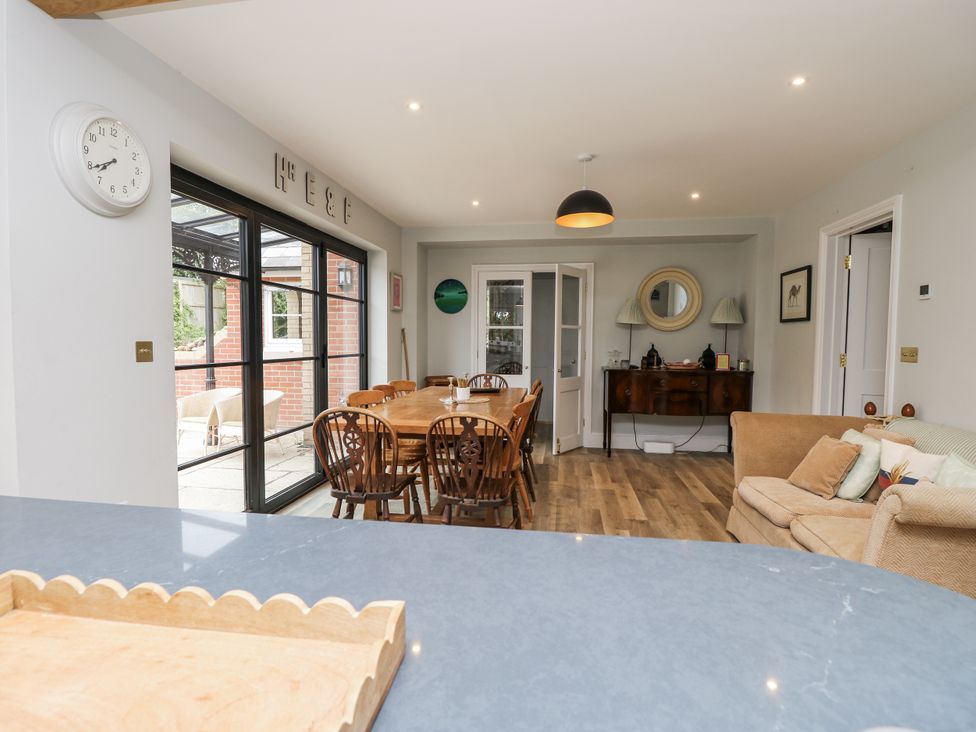 A dining room with a large table and chairs at Milston in Chale