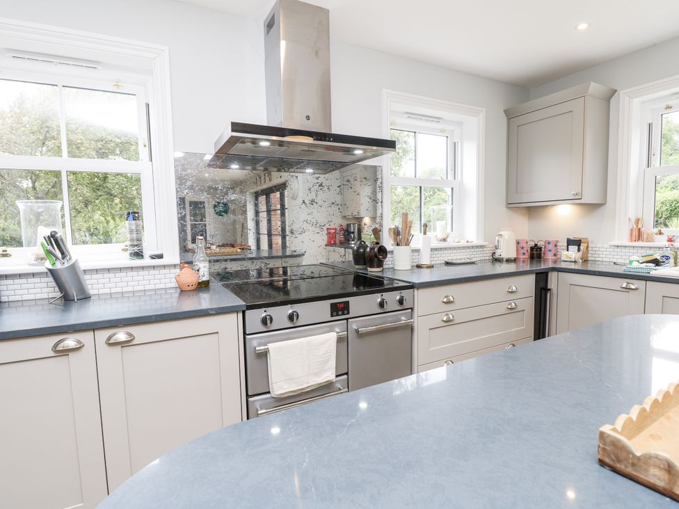 A kitchen with an oven and extractor hood at Milston in Chale