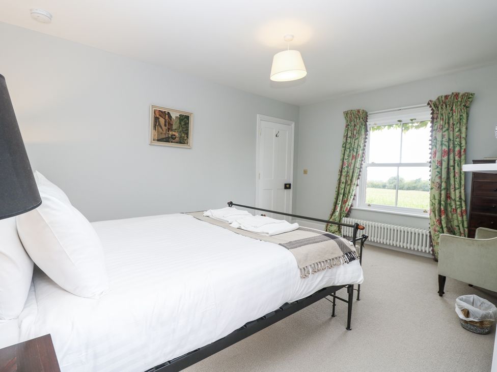 A bedroom with a bed and window at Milston in Chale