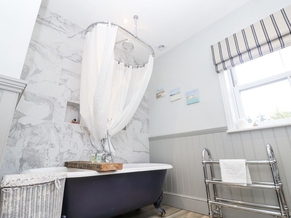 A bathroom with a bathtub and shower at Milston in Chale