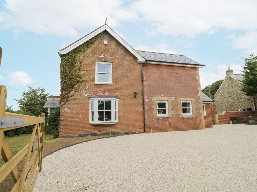 A house with windows and gravel driveway at Milston in Chale