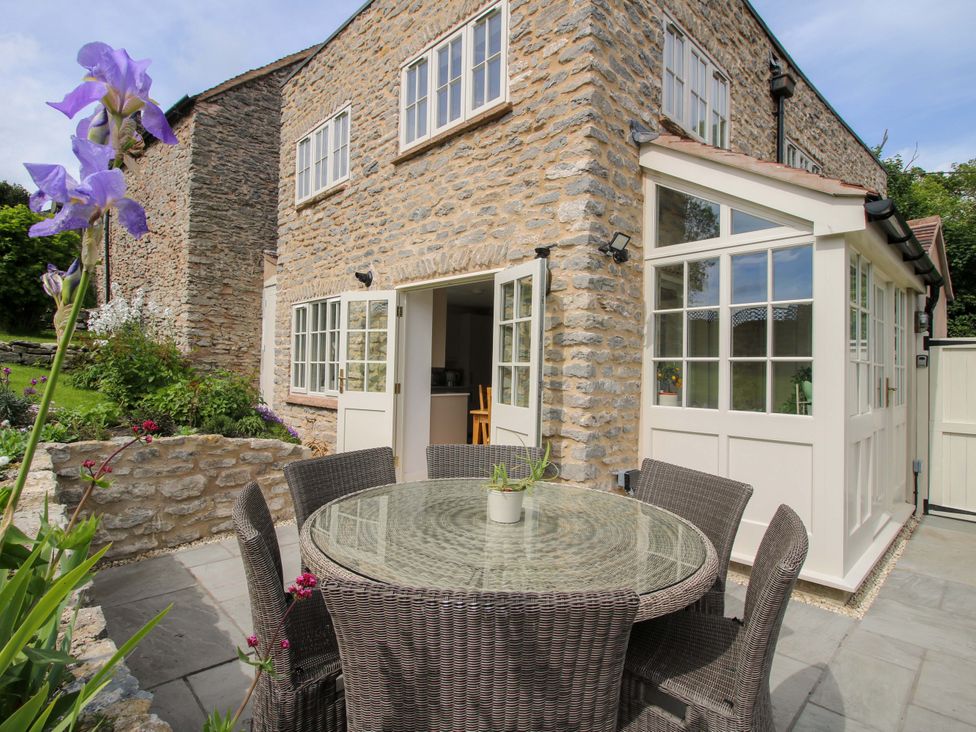 An outdoor area with a table and chairs at 5 Shrewsbury Road, Much Wenlock
