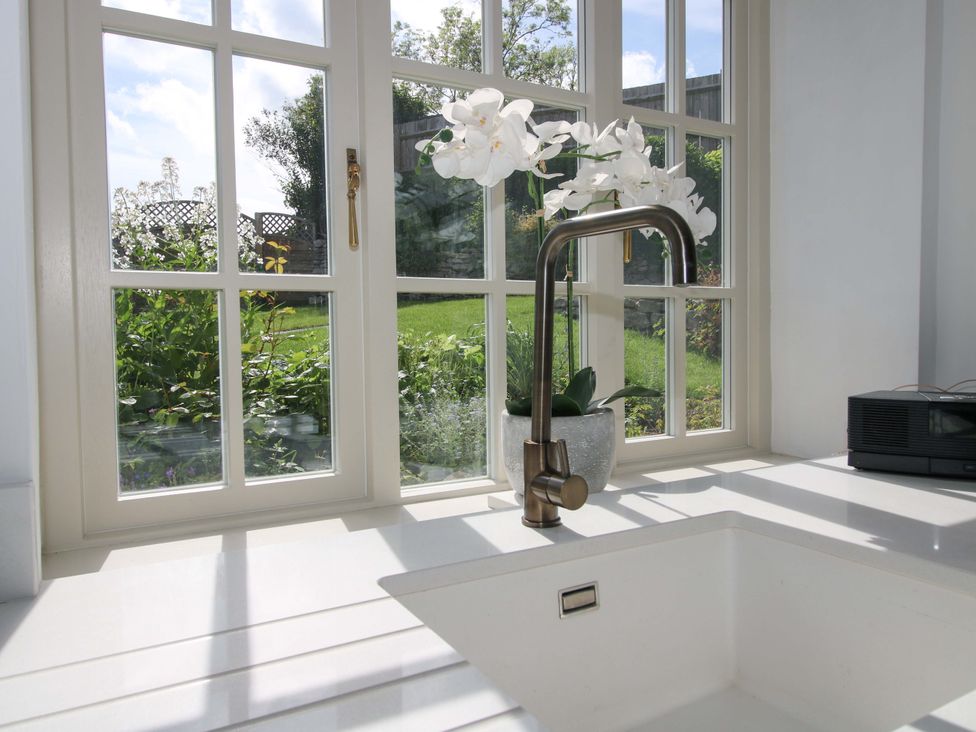 A kitchen with a sink and window at 5 Shrewsbury Road in Much Wenlock