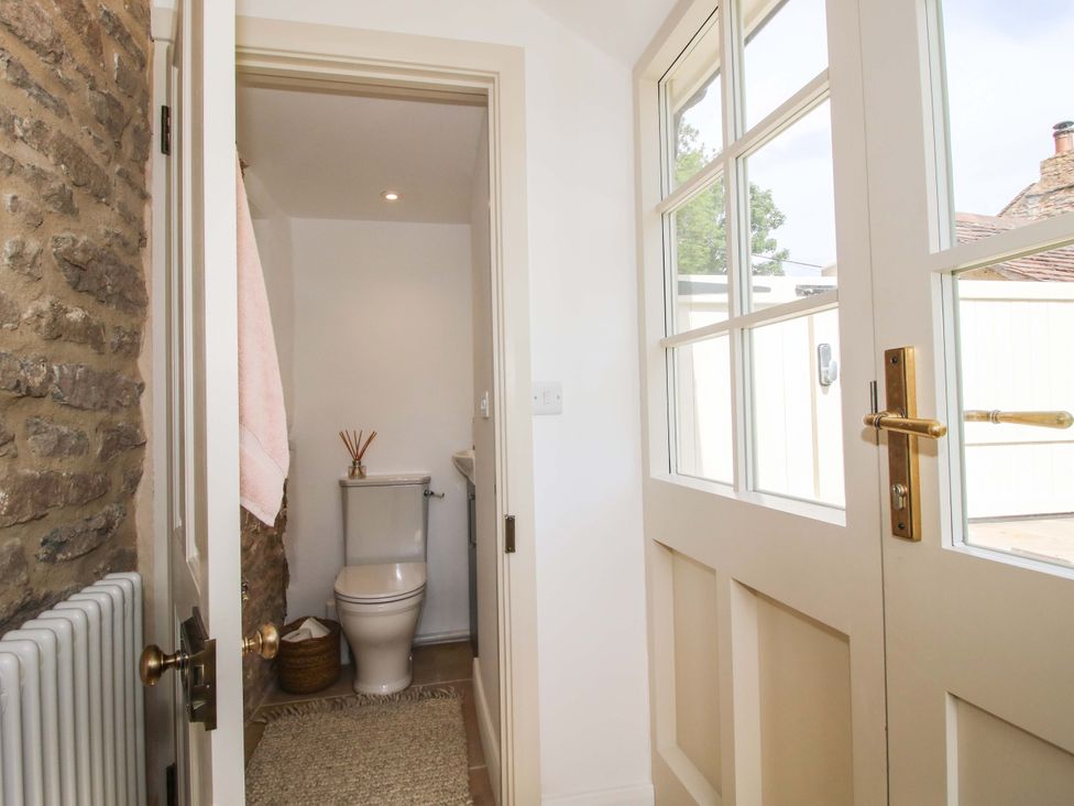 A bathroom with a toilet and a towel at 5 Shrewsbury Road Much Wenlock