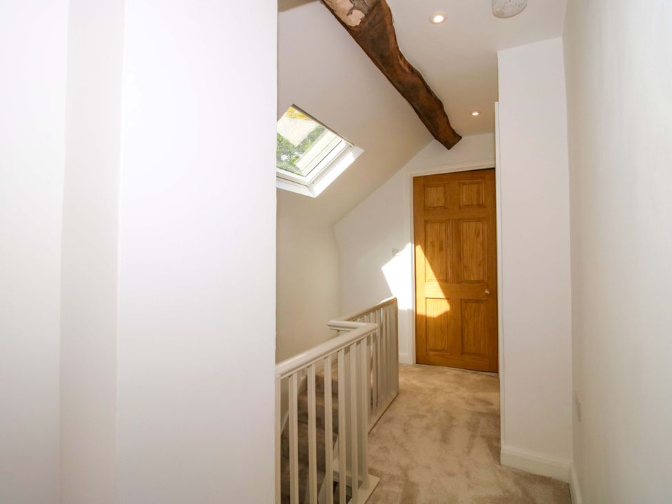 A hallway with a door and skylight at 5 Shrewsbury Road in Much Wenlock