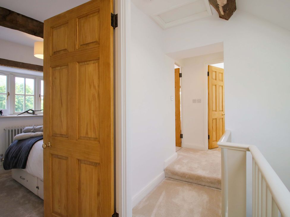 A hallway with doors and a staircase at 5 Shrewsbury Road in Much Wenlock