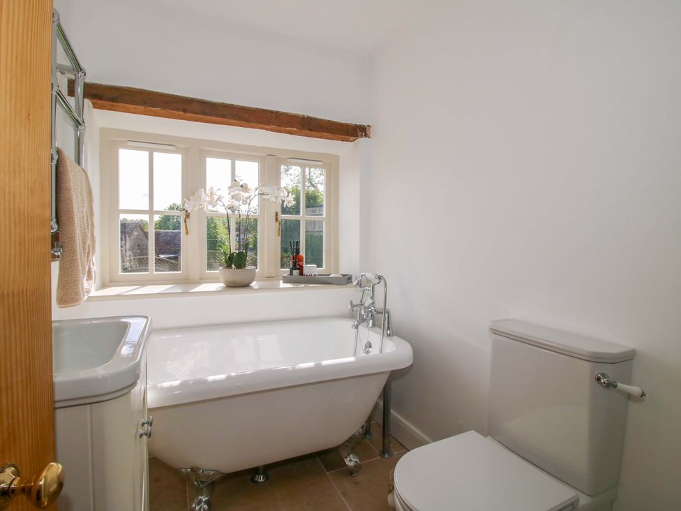 A bathroom with a bathtub and toilet at 5 Shrewsbury Road in Much Wenlock