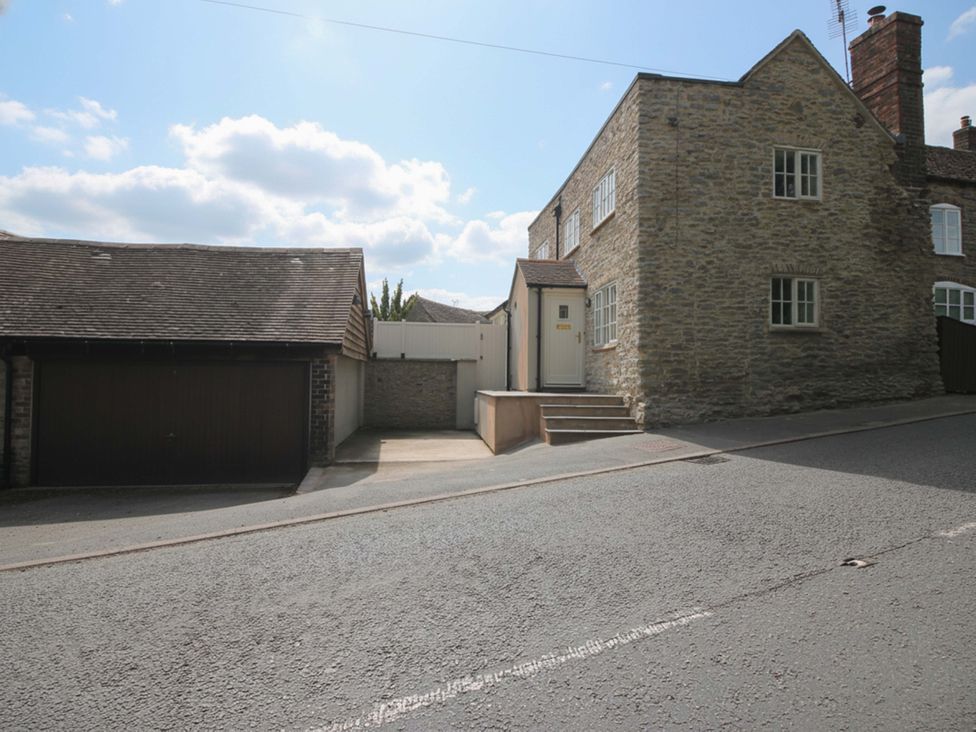 A house and garage with steps leading to the entrance at 5 Shrewsbury Road Much Wenlock