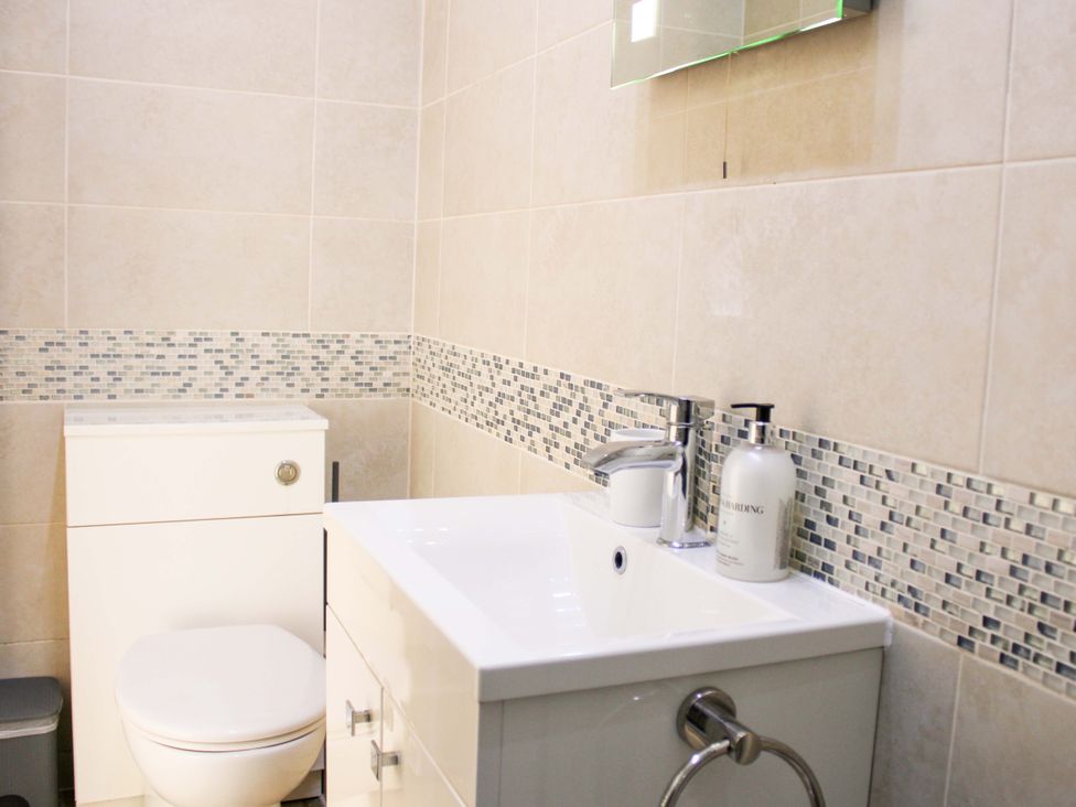 A bathroom with a sink and toilet at 2 The Elms Salcombe