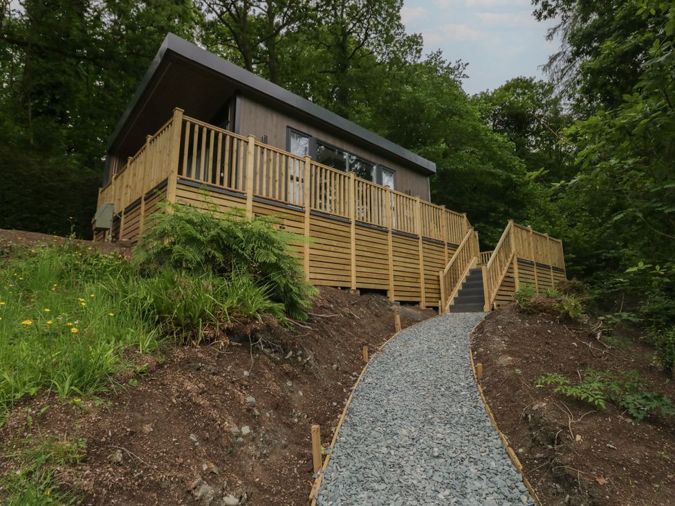A building with decking and a pathway at Hodge Luxury Pod in Keswick