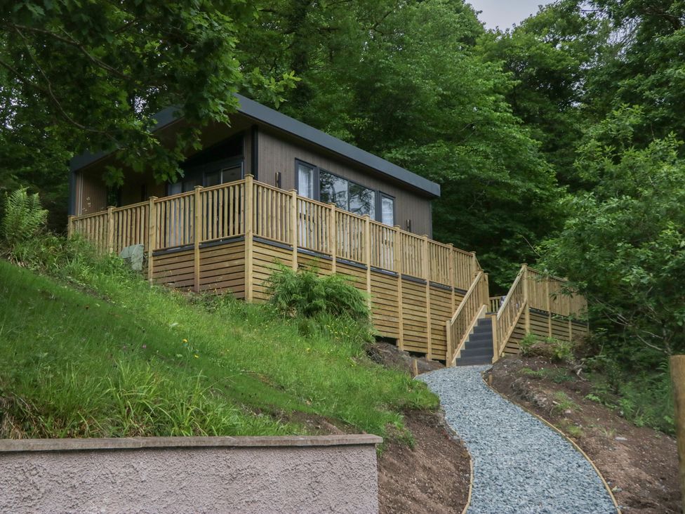 A house with decking and stairs in the outdoor area at Hodge Luxury Pod in Keswick