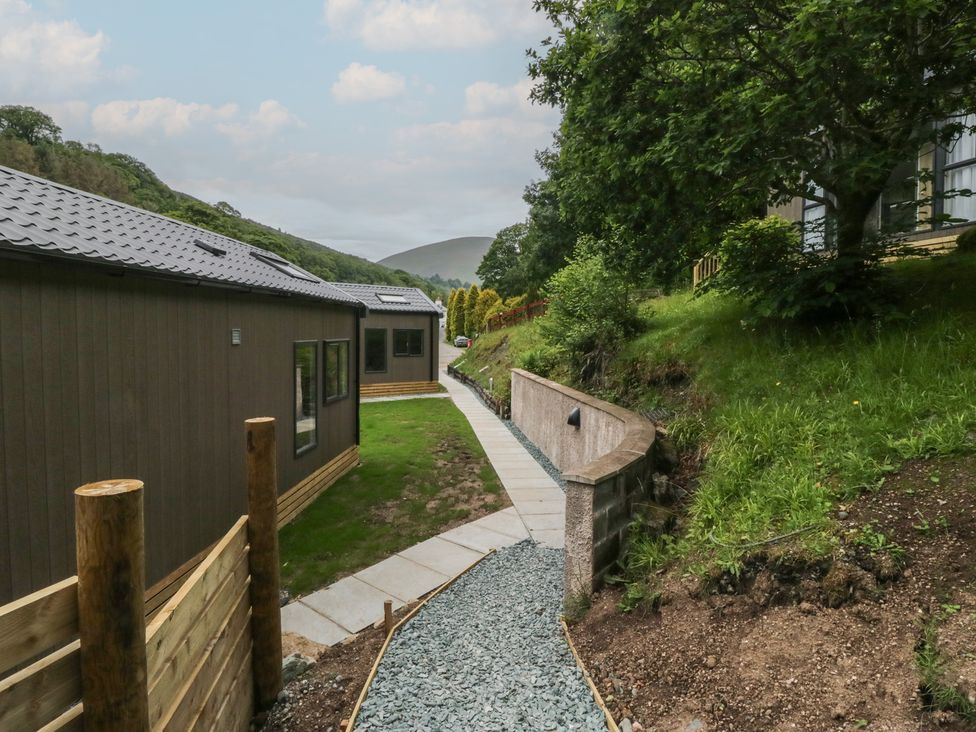 An outdoor area with buildings and a pathway at Dubs Luxury Family Pod in Keswick