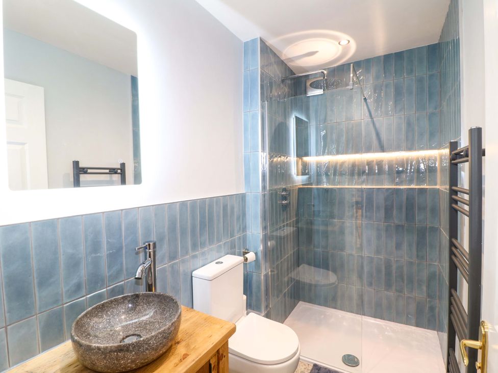 A bathroom with a sink and shower at High Peaks Villa in Buxton