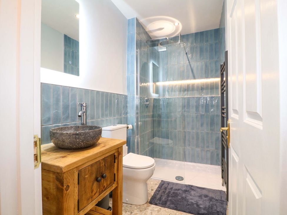 A bathroom with a sink and shower at High Peaks Villa Buxton