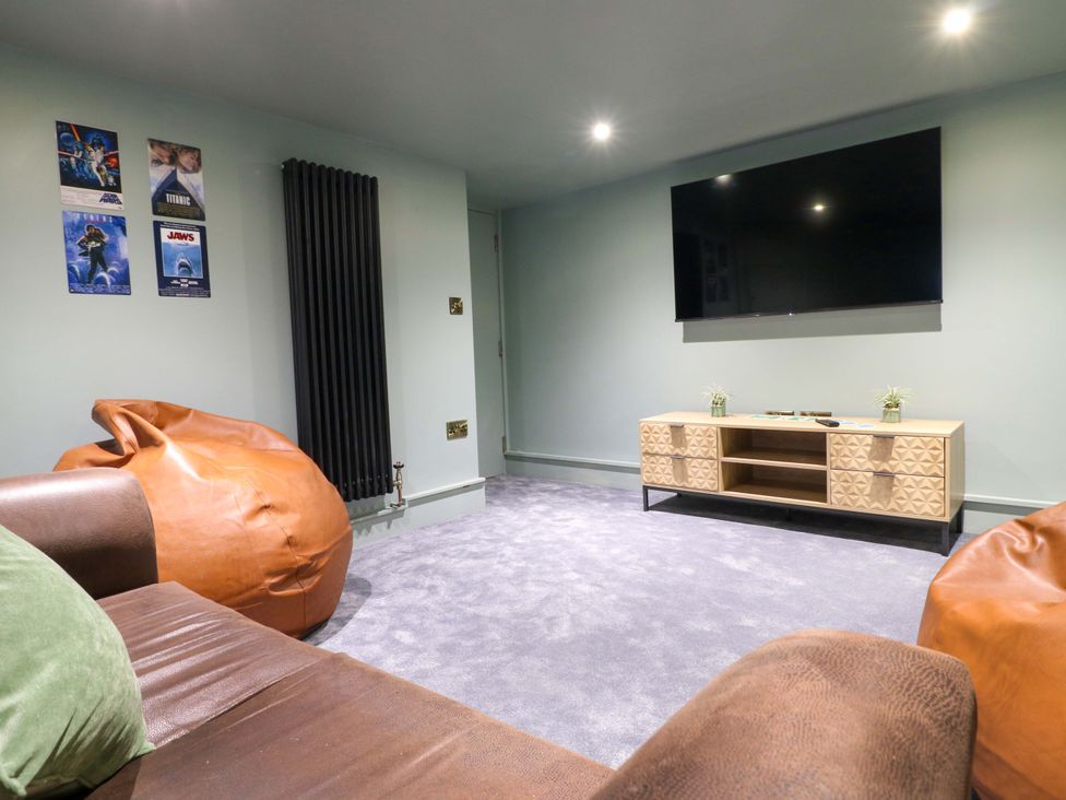 A snug with bean bags and television at High Peaks Villa Buxton