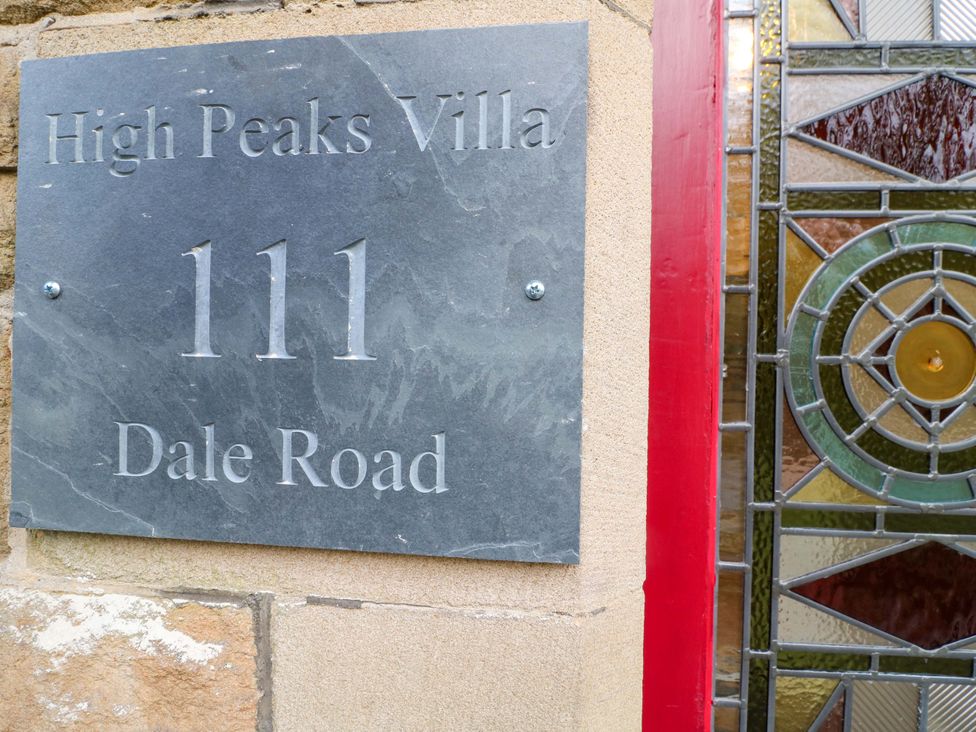 A house sign with High Peaks Villa located at 111 Dale Road