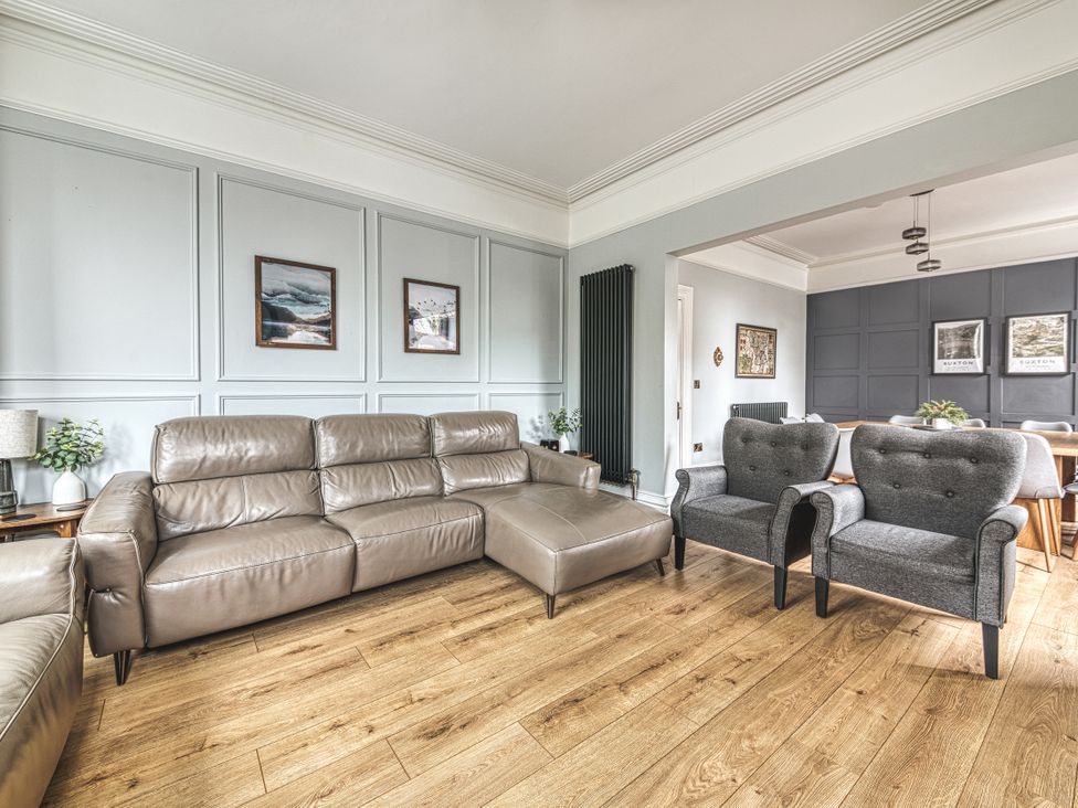 A living room with a sofa and armchairs at High Peaks Villa in Buxton