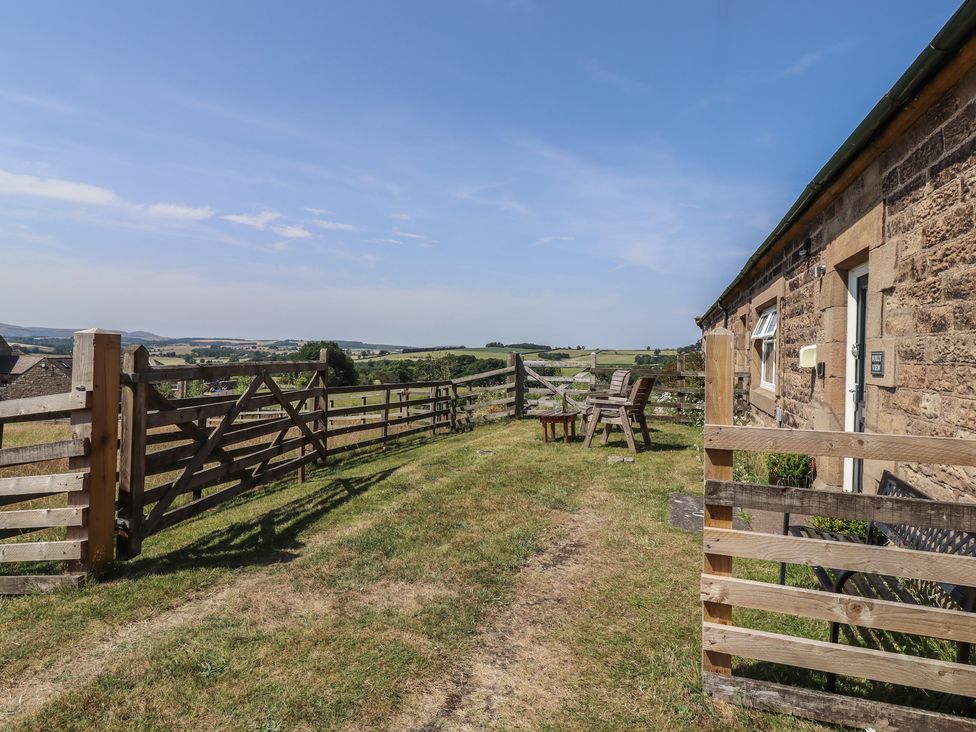 An outdoor area with chairs and a table at Folly View in Eglingham