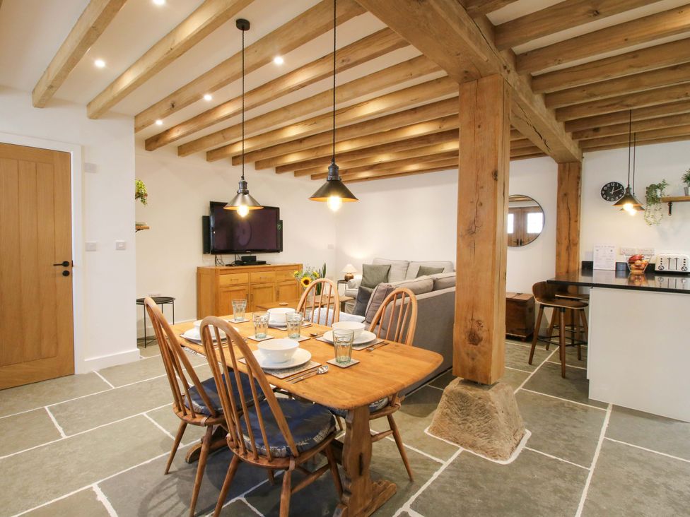 A dining area with a table and chairs at The Hideaway in Bishop's Castle