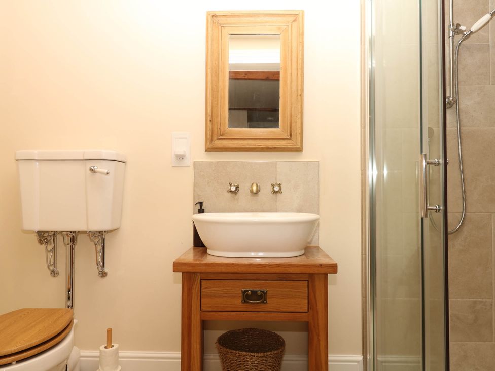 A bathroom with a sink and a shower at Higher Weekaborough Farm in Coombe Fishacre near Ipplepen