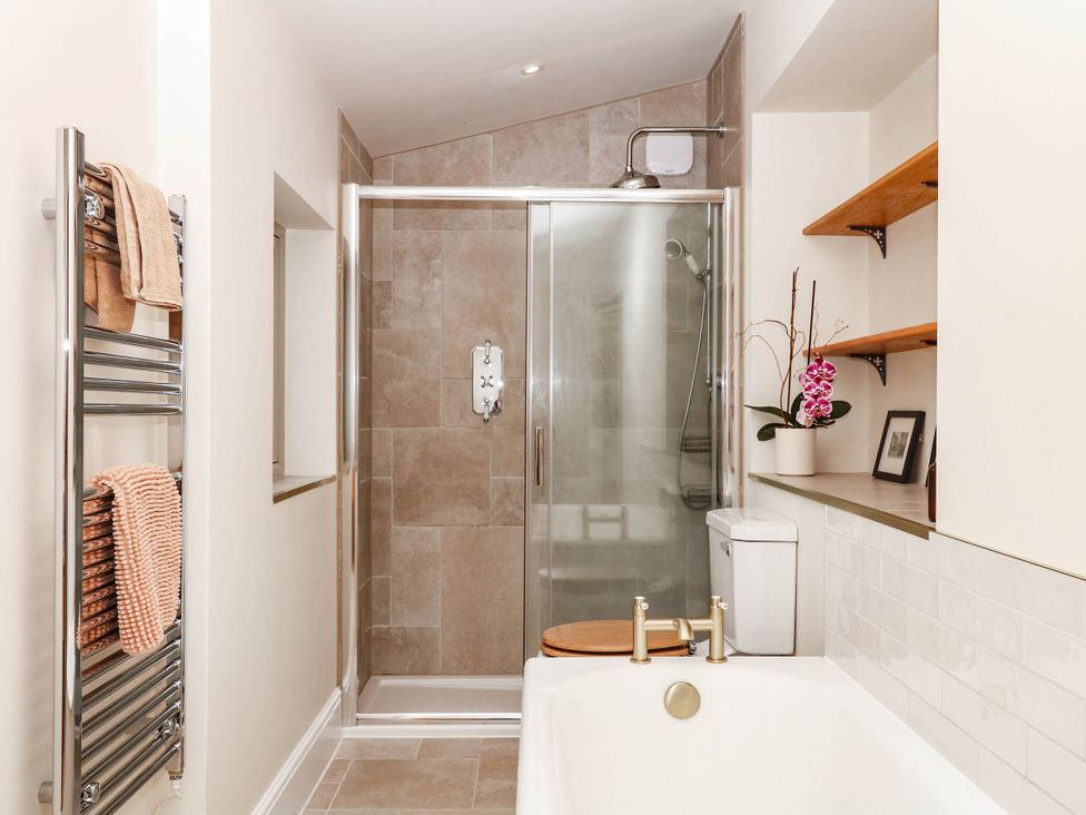 A bathroom with shower, bathtub, and toilet at Higher Weekaborough Farm in Coombe Fishacre near Ipplepen