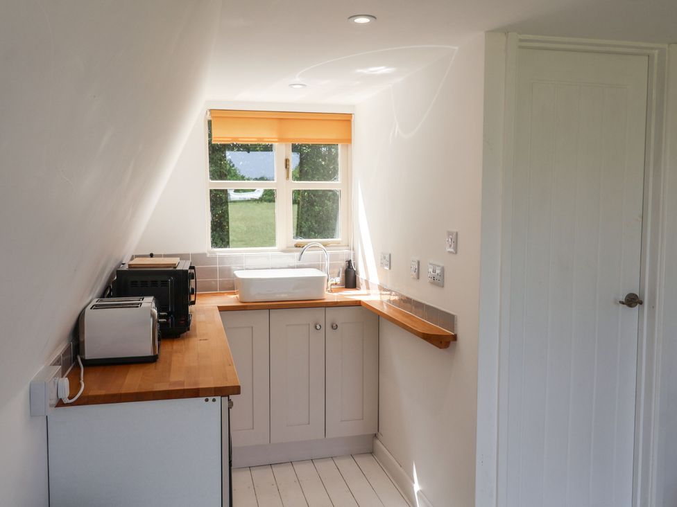 A kitchen with a sink and toaster at A-frame in Monewden near Otley, Suffolk