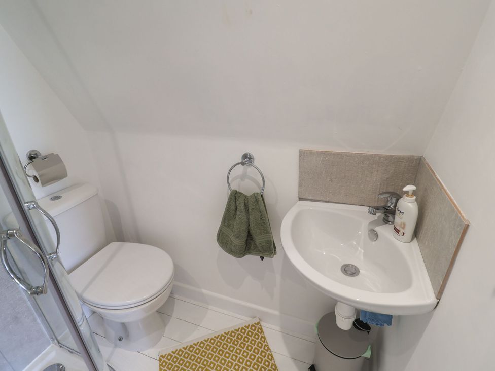 A bathroom with a toilet and sink at A-frame in Monewden near Otley, Suffolk