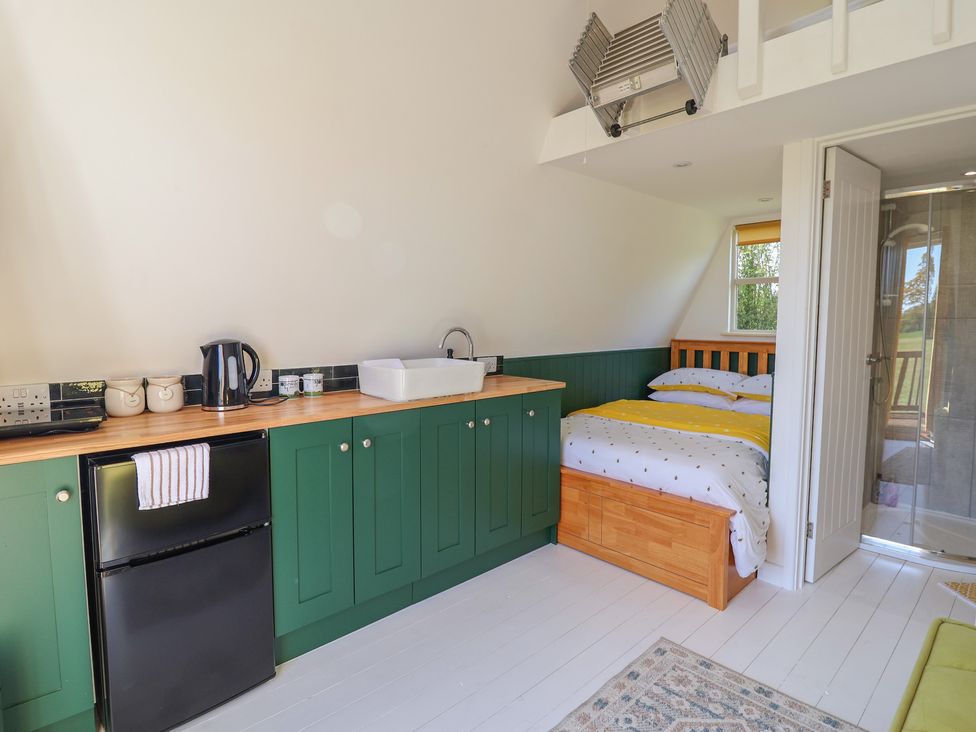 A studio room with a bed and kitchenette at A-frame in Monewden near Otley, Suffolk