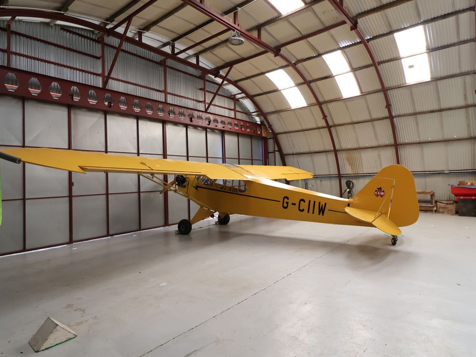 An airplane inside a hangar at A-frame in Monewden near Otley, Suffolk