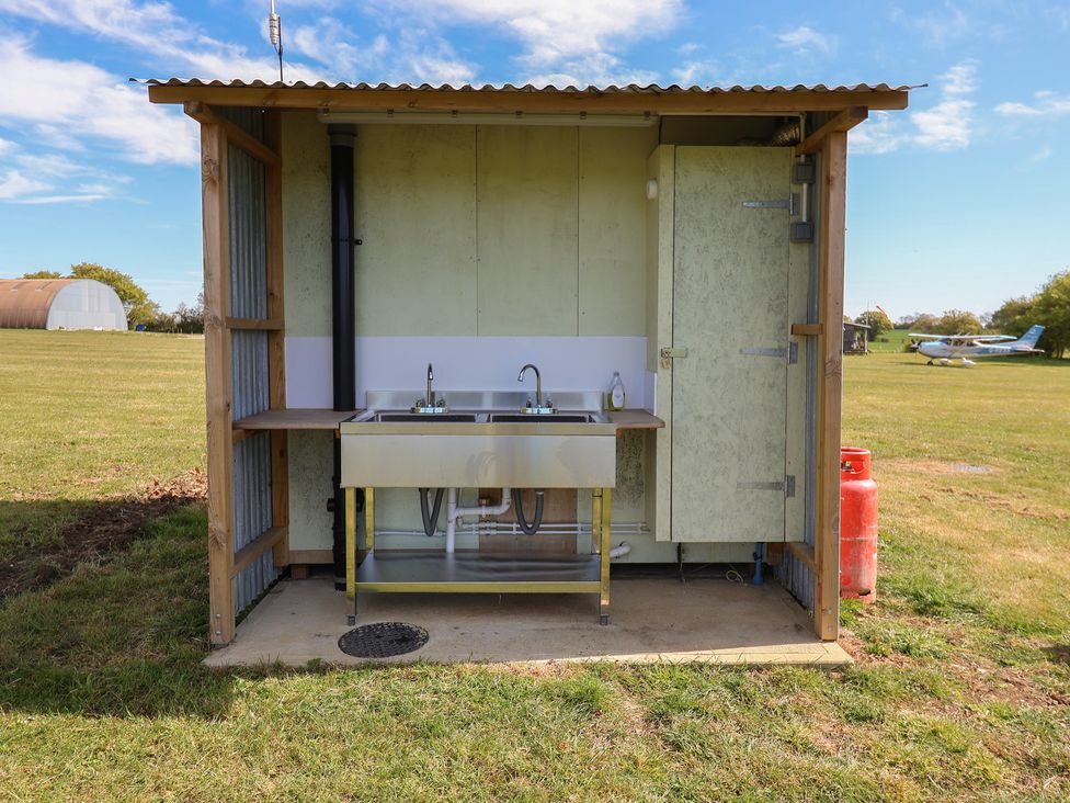 A structure with a sink and faucet at A-frame in Monewden near Otley, Suffolk