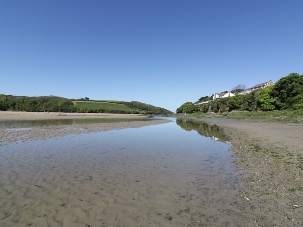 A landscape with water and reflections at Vosporth Villa in Newquay