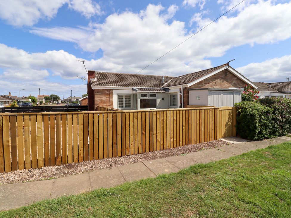 A house with a fence and garage at North Sands in Beadnell
