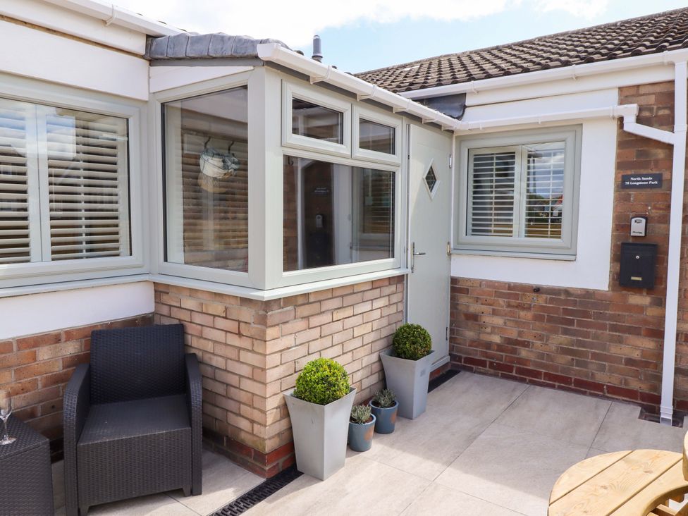 An entrance with a door and windows at North Sands Beadnell