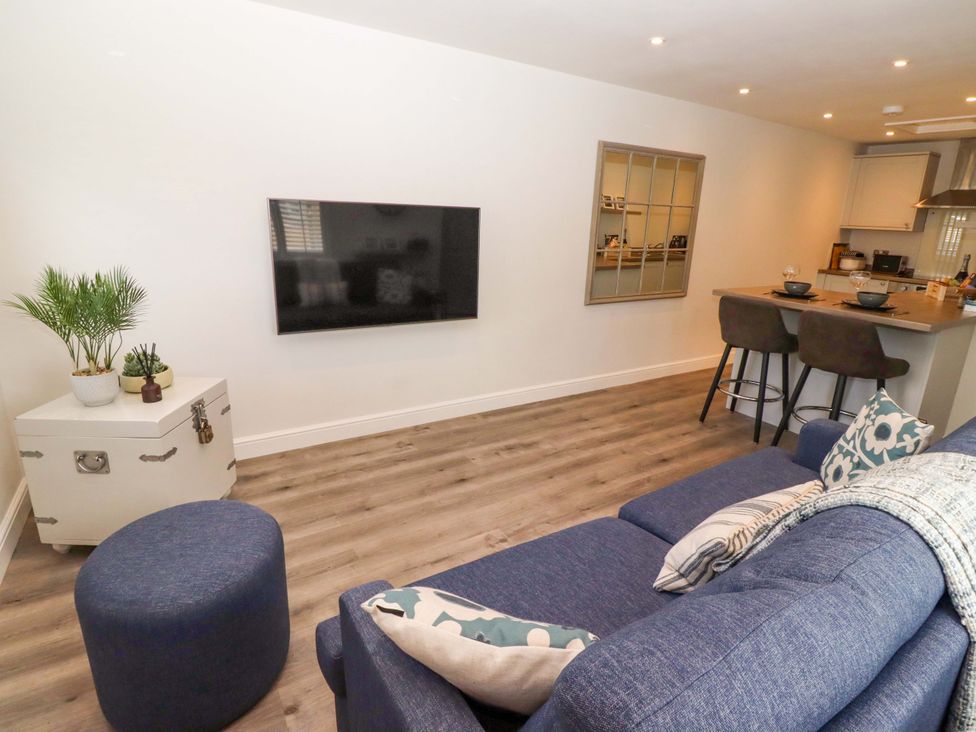 A living room with a sofa and television at North Sands Beadnell