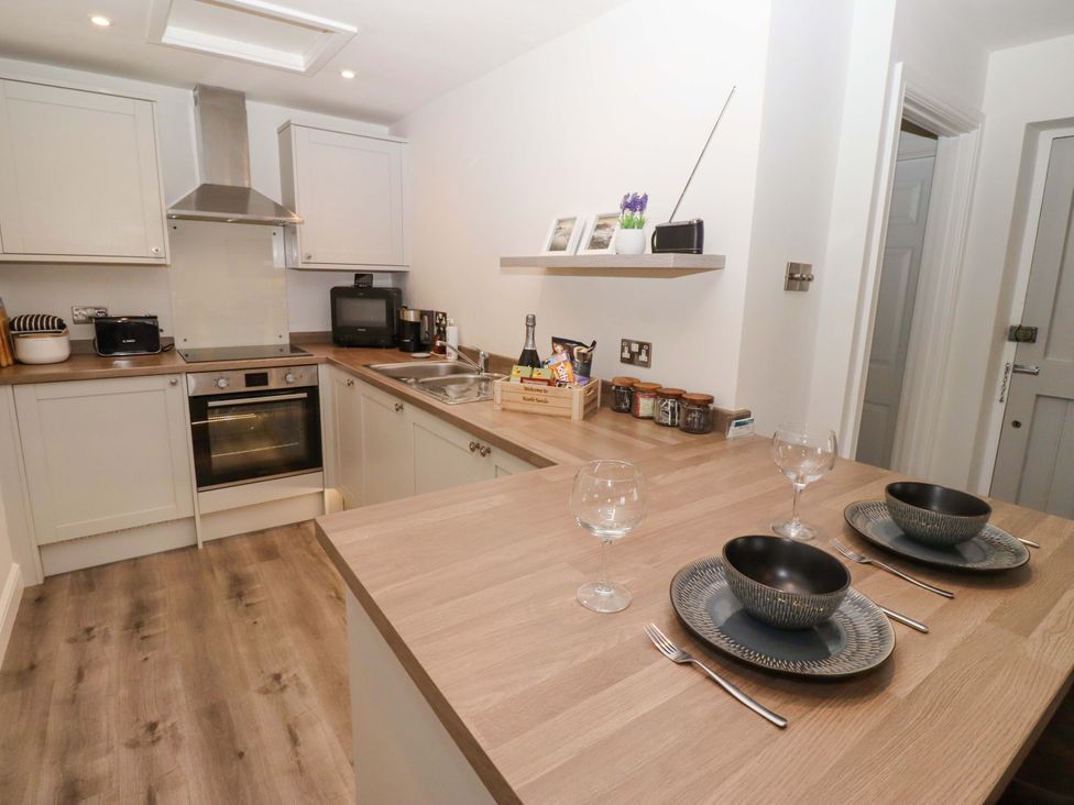 A kitchen with stove and sink at North Sands Beadnell
