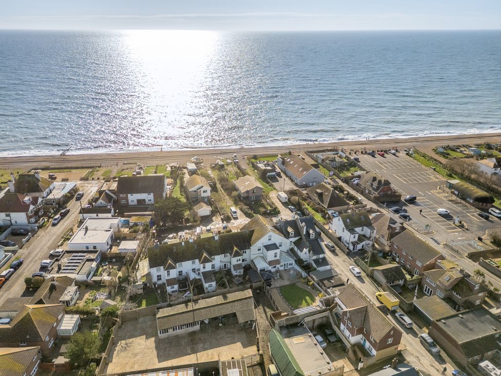 An aerial view of houses near a beach at Marine House Pevensey Bay