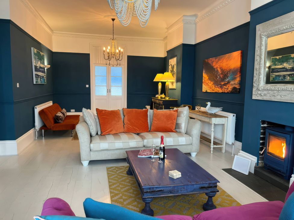A living room with furniture and decor at Marine House in Pevensey Bay