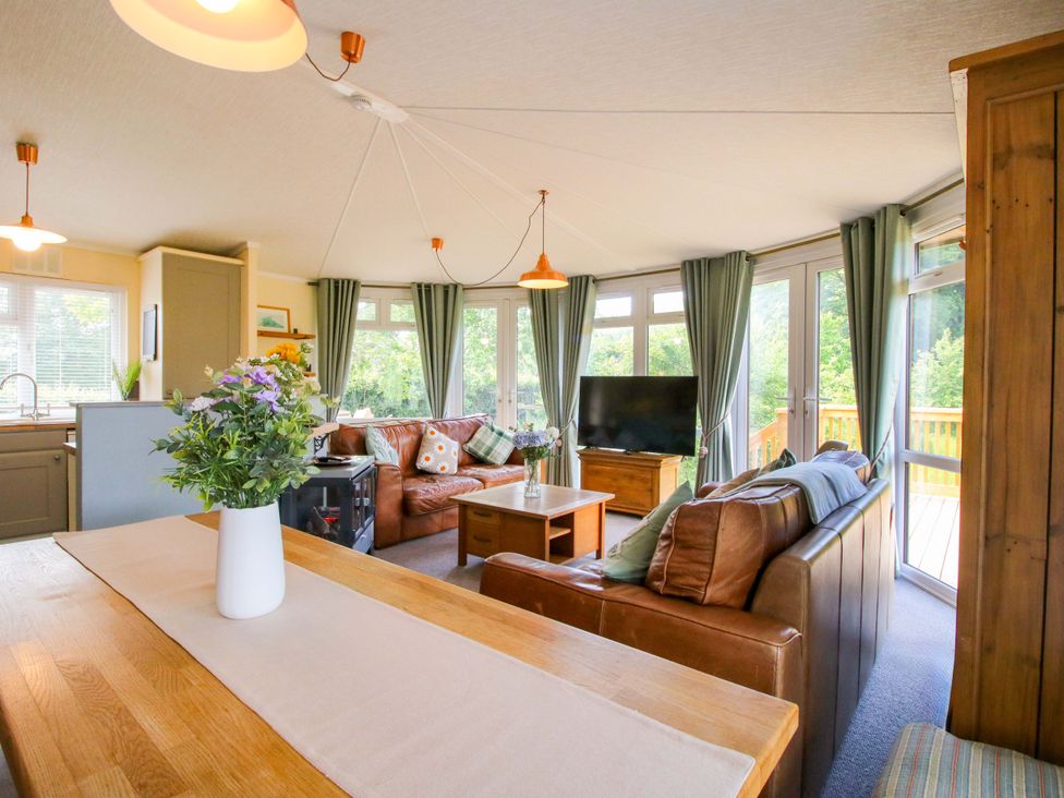 A living room with a sofa and a coffee table at Dunromin in Montgomery