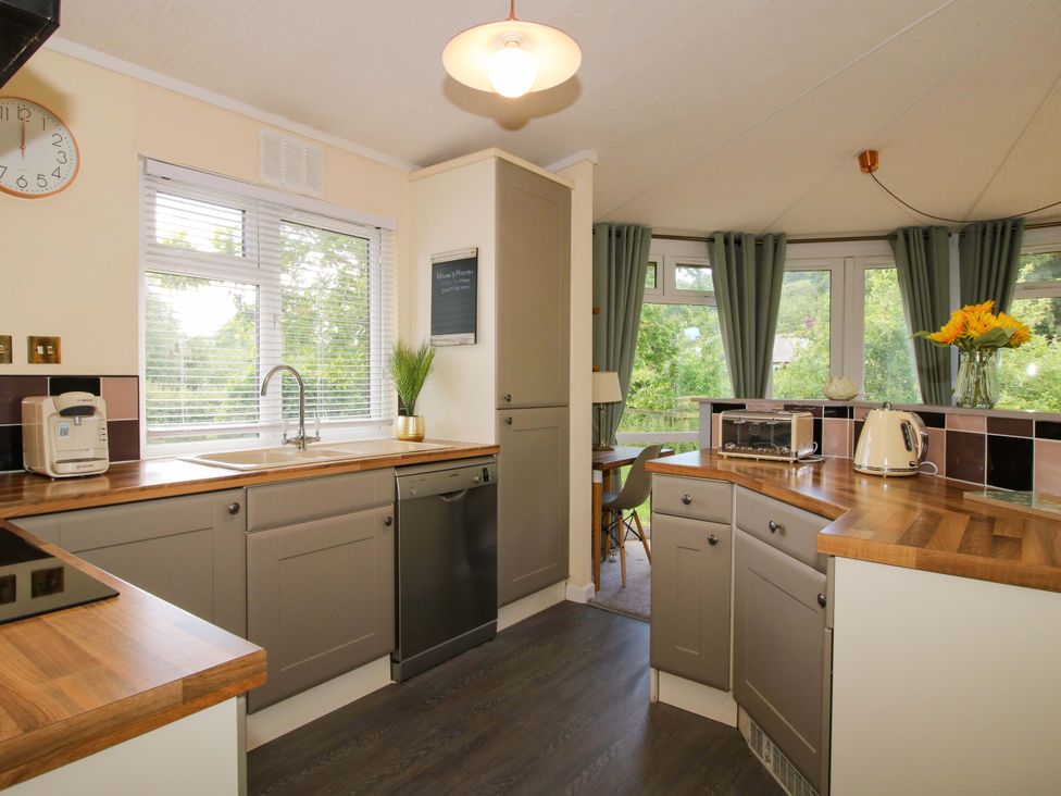A kitchen with appliances and a window at Dunromin in Montgomery