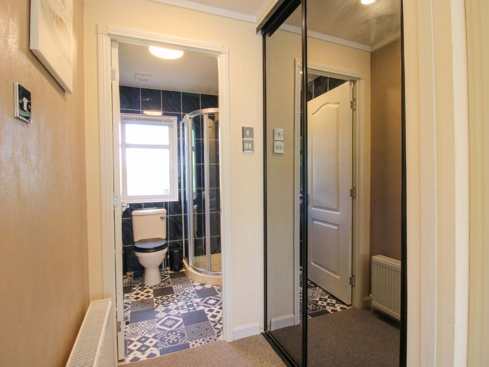 A bathroom with toilet and shower visible at Dunromin in Montgomery