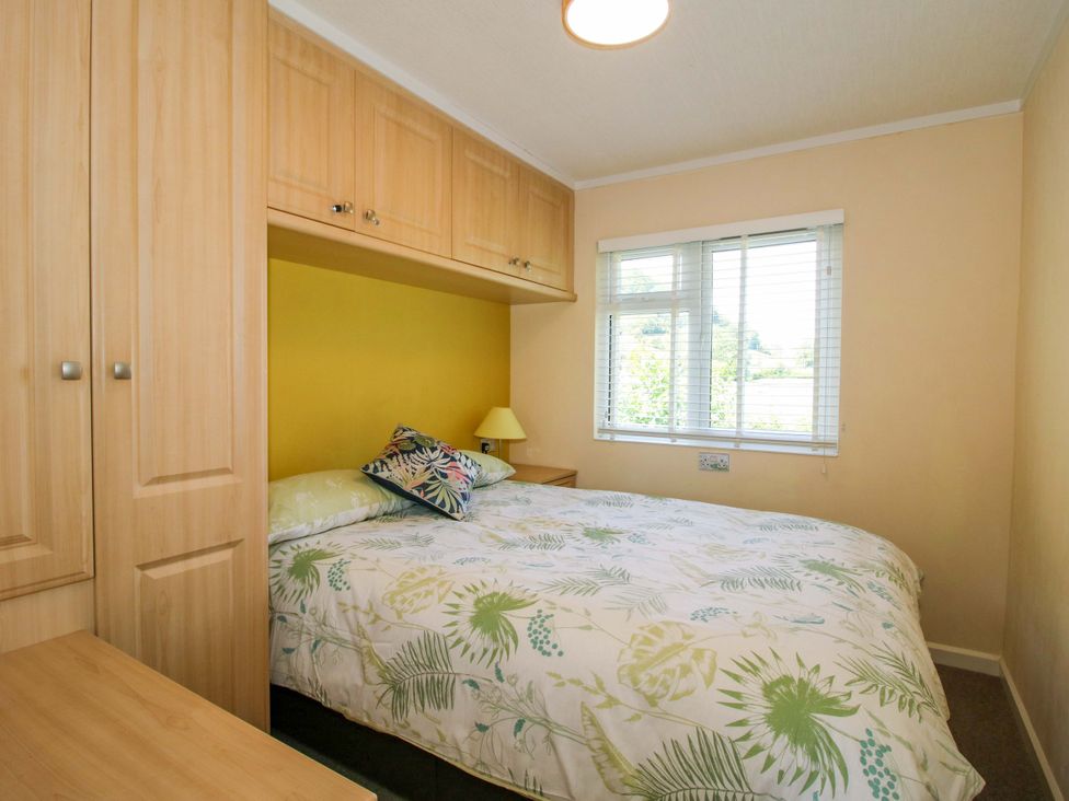 A bedroom with a bed and a window at Dunromin in Montgomery