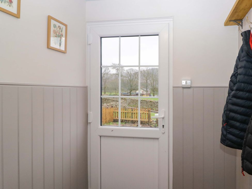 An entryway with a door and coat hanging at Dakota in Boot